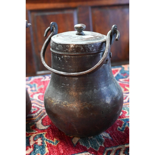 569 - A collection of antique Persian Qajar Islamic tinned copper metal ware including a large slender pit... 