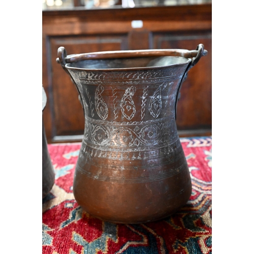 569 - A collection of antique Persian Qajar Islamic tinned copper metal ware including a large slender pit... 