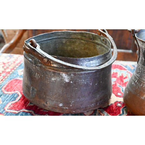 569 - A collection of antique Persian Qajar Islamic tinned copper metal ware including a large slender pit... 