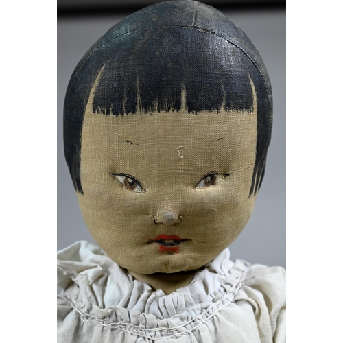 571 - A vintage Chinese cloth girl doll with stockinette fabric body, 50 cm