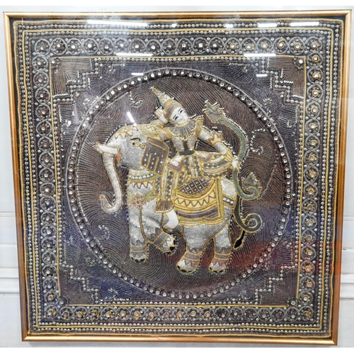 573 - A traditional Burmese (Myanmar) Kalaga applique tapestry panel depicting a figure riding and elephan... 