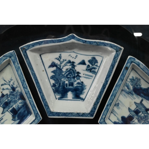 574 - A Chinese blue and white sweetmeat or rice table set comprising eight interlocking dishes surroundin... 