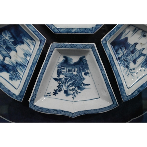 574 - A Chinese blue and white sweetmeat or rice table set comprising eight interlocking dishes surroundin... 