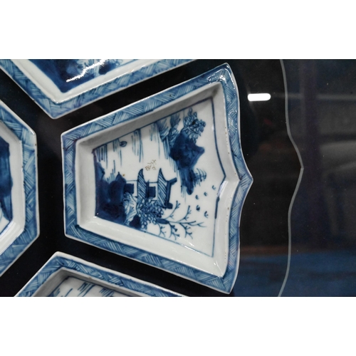 574 - A Chinese blue and white sweetmeat or rice table set comprising eight interlocking dishes surroundin... 