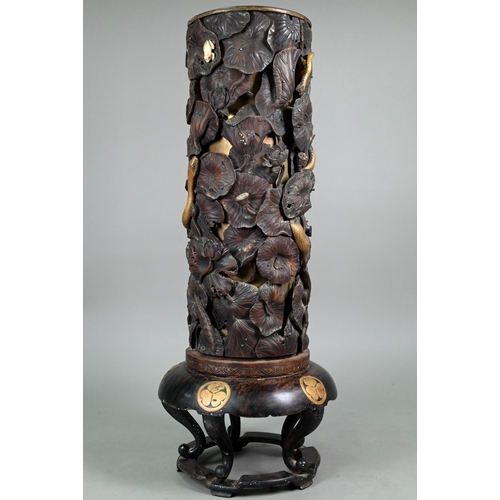 575 - A 19th century Japanese Shibayama hardwood stick stand with brass liner, profusely carved and reticu... 