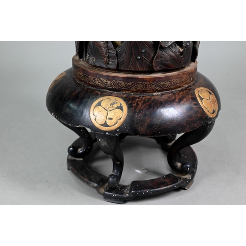 575 - A 19th century Japanese Shibayama hardwood stick stand with brass liner, profusely carved and reticu... 