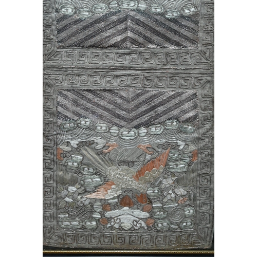 582 - A Chinese silk work civil rank badge embroidered panel, coloured and metallic threads, framed and gl... 