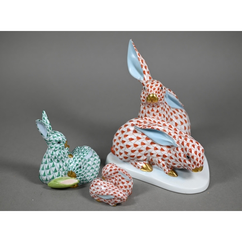 591 - A Herend red-scale group of two rabbits, 15 cm high to/w a smaller green-scale two rabbit group 8.5 ... 