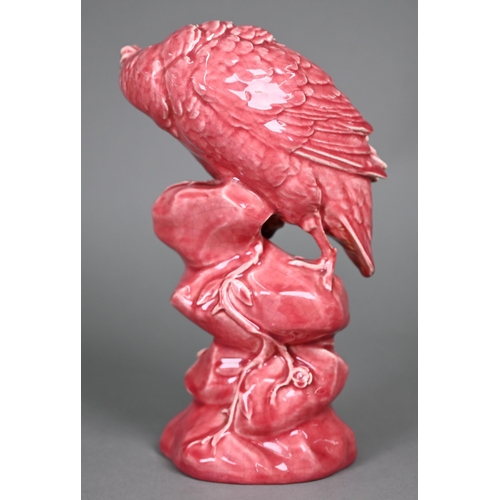 596 - A Minton pink majolica partridge perched on a rock, inspecting a snail, 33 cm high (c 1900)