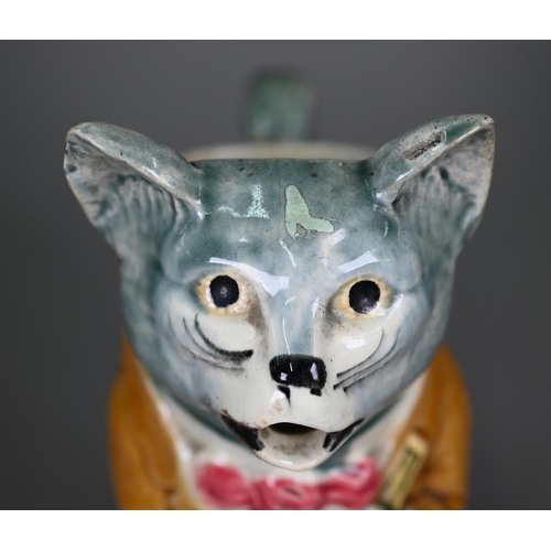 600 - A French majolica pottery novelty water-jug, modelled as a cat night-club singer with guitar, inscri... 