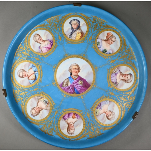 617 - A 19th century Sèvres porcelain large circular tray, painted with a portrait of Louis XV, encircled ... 