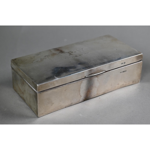 62 - A silver cigarette box, Sheffield 1919, to/w a Christening mug, two napkin rings, a weighted vase-fl... 