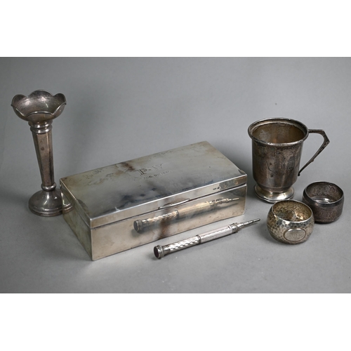 62 - A silver cigarette box, Sheffield 1919, to/w a Christening mug, two napkin rings, a weighted vase-fl... 