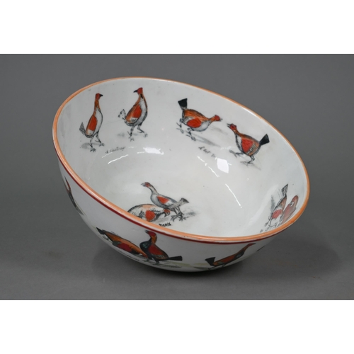 625 - A 19th century Staffordshire china punch bowl printed with cock-fighting scenes, 23 cm (restored)