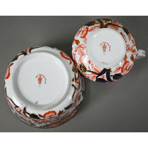 632 - A Royal Crown Derby Imari tea service comprising tea cups and saucers, twelve plates and a milk and ... 