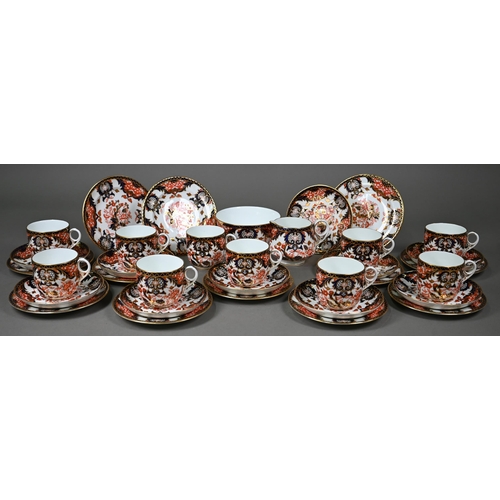 632 - A Royal Crown Derby Imari tea service comprising tea cups and saucers, twelve plates and a milk and ... 