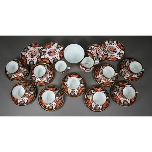 632 - A Royal Crown Derby Imari tea service comprising tea cups and saucers, twelve plates and a milk and ... 