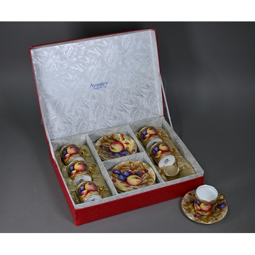 638 - A boxed set of six each Aynsley coffee cans and saucers, printed with fruit (one saucer chipped unde... 