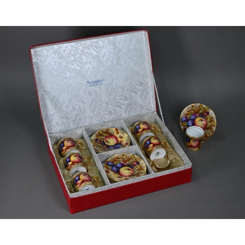 638 - A boxed set of six each Aynsley coffee cans and saucers, printed with fruit (one saucer chipped unde... 