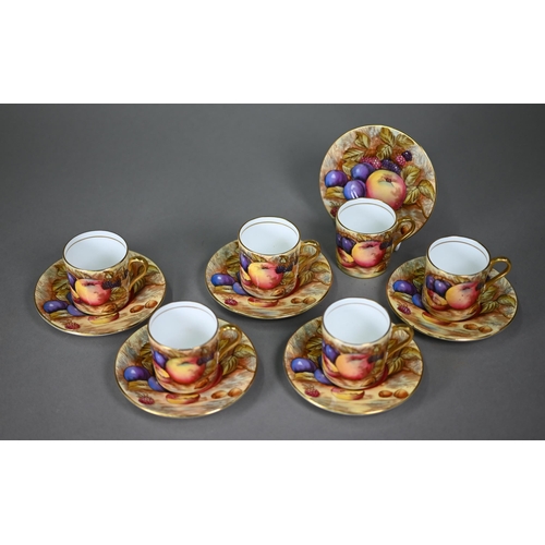 638 - A boxed set of six each Aynsley coffee cans and saucers, printed with fruit (one saucer chipped unde... 