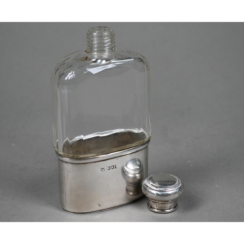 64 - An Edwardian cut glass hip flask with silver cover and detachable beaker, London 1906, to/w a capsta... 