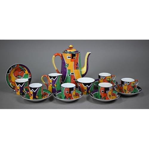 641 - An Art Deco pottery coffee service printed with polychrome abstract designs, comprising coffee pot, ... 