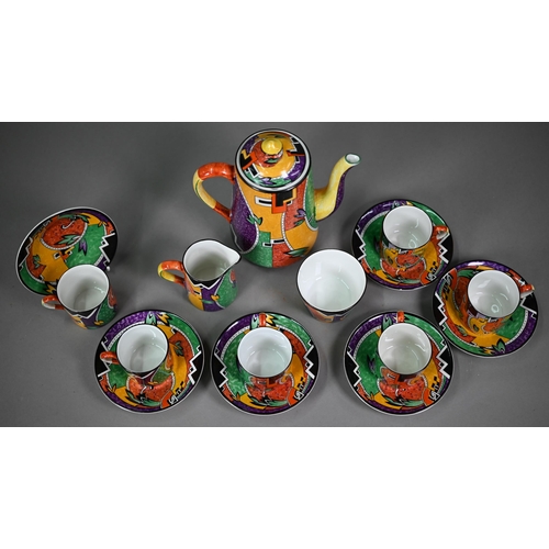 641 - An Art Deco pottery coffee service printed with polychrome abstract designs, comprising coffee pot, ... 