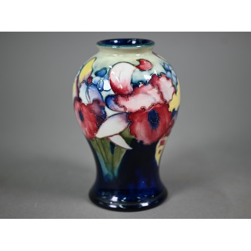 646 - A Walter Moorcroft baluster vase, decorated with irises, 15 cm