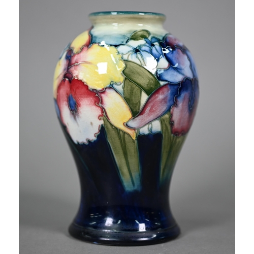 646 - A Walter Moorcroft baluster vase, decorated with irises, 15 cm