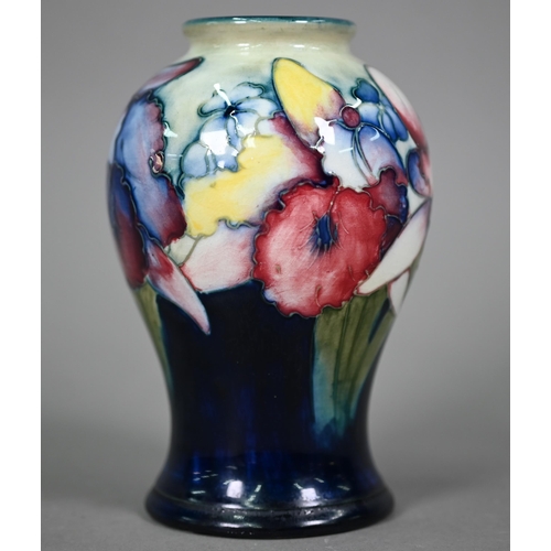 646 - A Walter Moorcroft baluster vase, decorated with irises, 15 cm