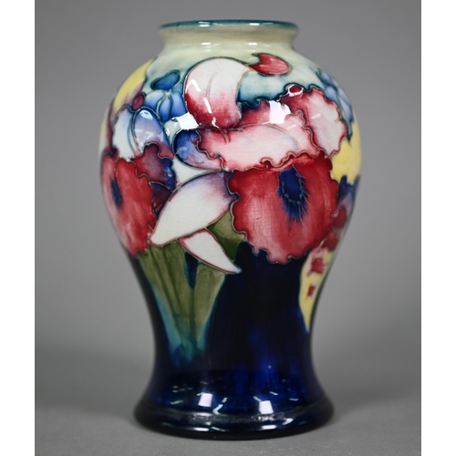 646 - A Walter Moorcroft baluster vase, decorated with irises, 15 cm