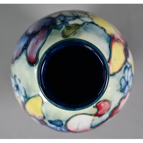 646 - A Walter Moorcroft baluster vase, decorated with irises, 15 cm