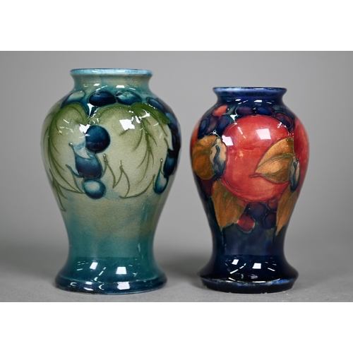 647 - A Walter Moorcroft cream and sugar pair, decorated with grapes and vines on a celadon ground, to/w t... 