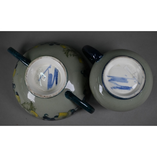 647 - A Walter Moorcroft cream and sugar pair, decorated with grapes and vines on a celadon ground, to/w t... 