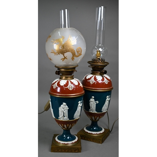 650 - A pair of Victorian glazed stoneware baluster oil-lamps with classical figures to the blue-glazed fr... 