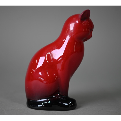 653 - A Royal Doulton Flambé seated cat, 13 cm high to/w two small onion-shaped vases, Woodcut 1606 and Ve... 