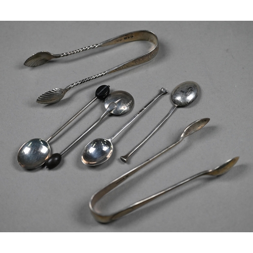 66 - Six silver coffee spoons with bean finials and various other silver spoons, tongs, napkin rings and ... 