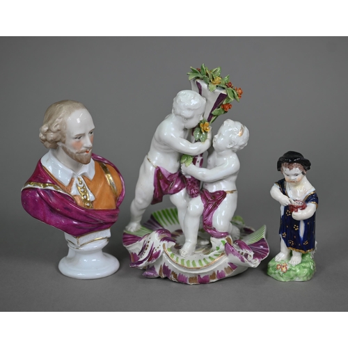 666 - An 18th century Vienna porcelain group, two putti squabbling over a floral cornucopia, on scrolling ... 