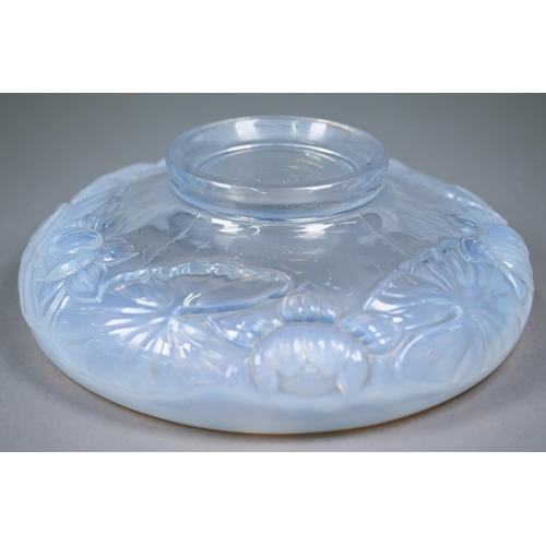 680 - A 1930s blue opalescent pressed glass bowl, moulded with waterlilies (unmarked) 28 cm diam