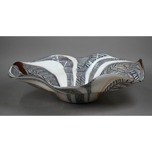 680A - A Luca Vidal Murano bowl with elongated outsize cane swirling designs, 53 x 44cm