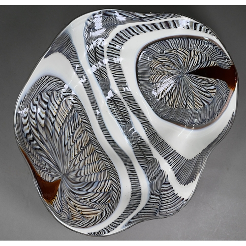 680A - A Luca Vidal Murano bowl with elongated outsize cane swirling designs, 53 x 44cm