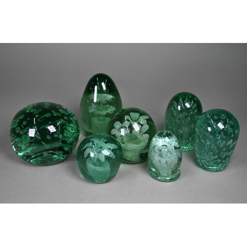 686 - Four Stourbridge green glass 'dumps' with internal floral designs to/w three dumps with bubbles, 12.... 