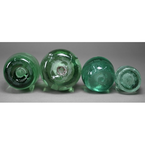 686 - Four Stourbridge green glass 'dumps' with internal floral designs to/w three dumps with bubbles, 12.... 