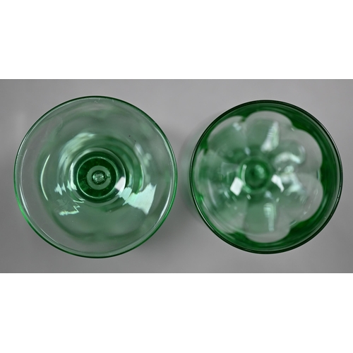 688 - A set of eight green cut wine-glasses with hollow baluster stems and ground-out pontils