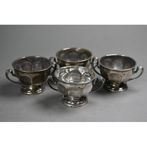 77 - A set of four silver salts with scroll handles and stemmed foot, Sibray, Hall & Co., Sheffield 1... 