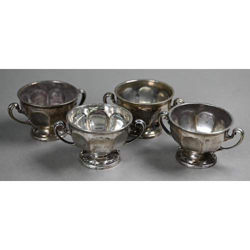 77 - A set of four silver salts with scroll handles and stemmed foot, Sibray, Hall & Co., Sheffield 1... 