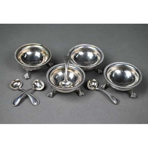 82 - A set of four Victorian silver circular salts with beaded rims and claw and ball feet, Thomas White,... 