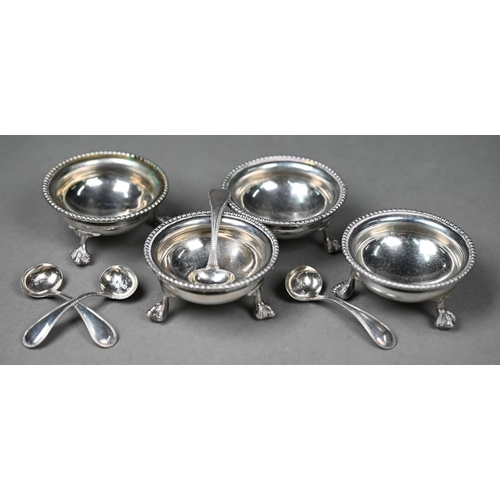 82 - A set of four Victorian silver circular salts with beaded rims and claw and ball feet, Thomas White,... 