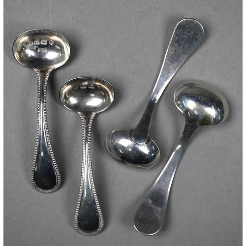 82 - A set of four Victorian silver circular salts with beaded rims and claw and ball feet, Thomas White,... 