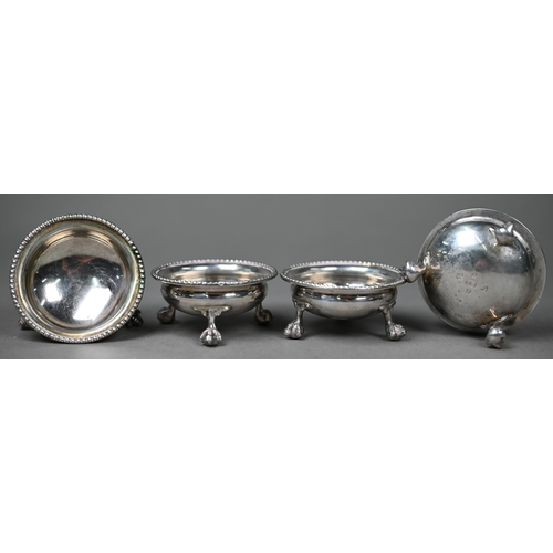 82 - A set of four Victorian silver circular salts with beaded rims and claw and ball feet, Thomas White,... 